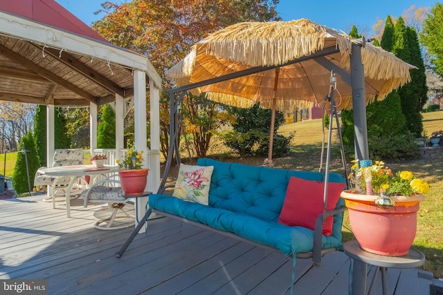 deck featuring an outdoor living space and a gazebo