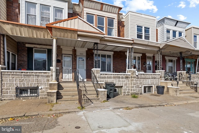 view of property with covered porch