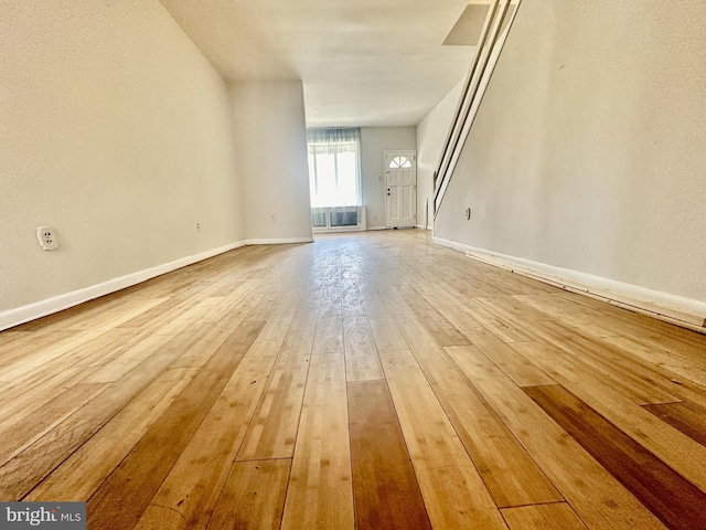 unfurnished living room with light wood-type flooring