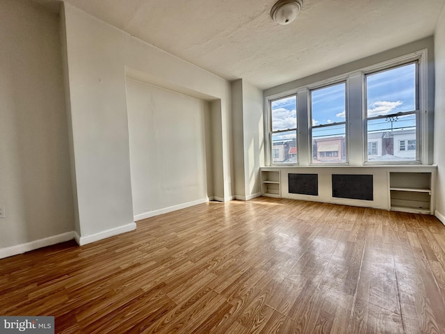 empty room featuring hardwood / wood-style flooring