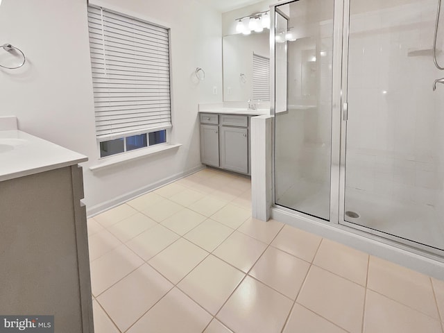 bathroom with vanity, tile patterned floors, and walk in shower