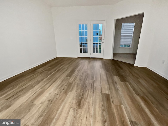 empty room with hardwood / wood-style flooring