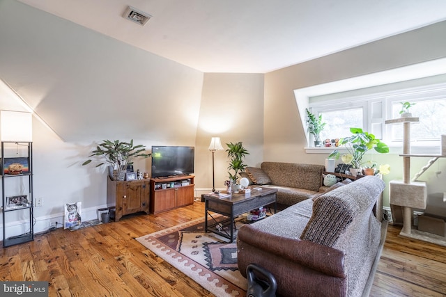 living room with light hardwood / wood-style floors