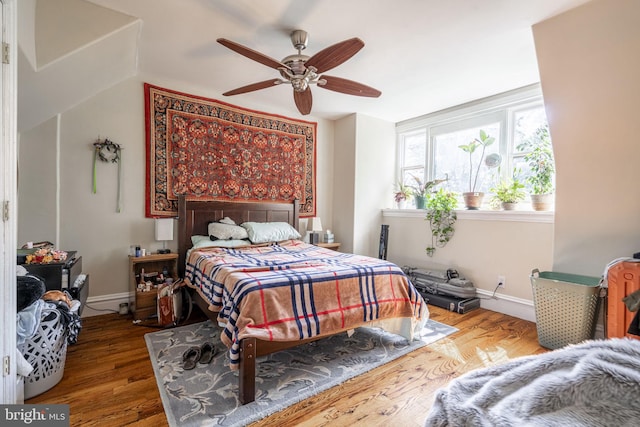 bedroom featuring wood-type flooring and ceiling fan