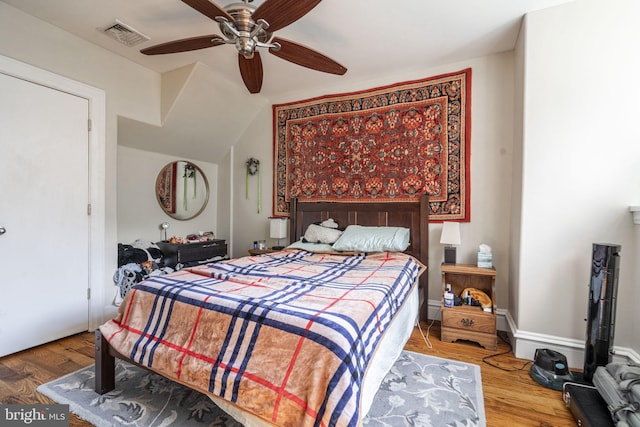 bedroom featuring hardwood / wood-style flooring and ceiling fan