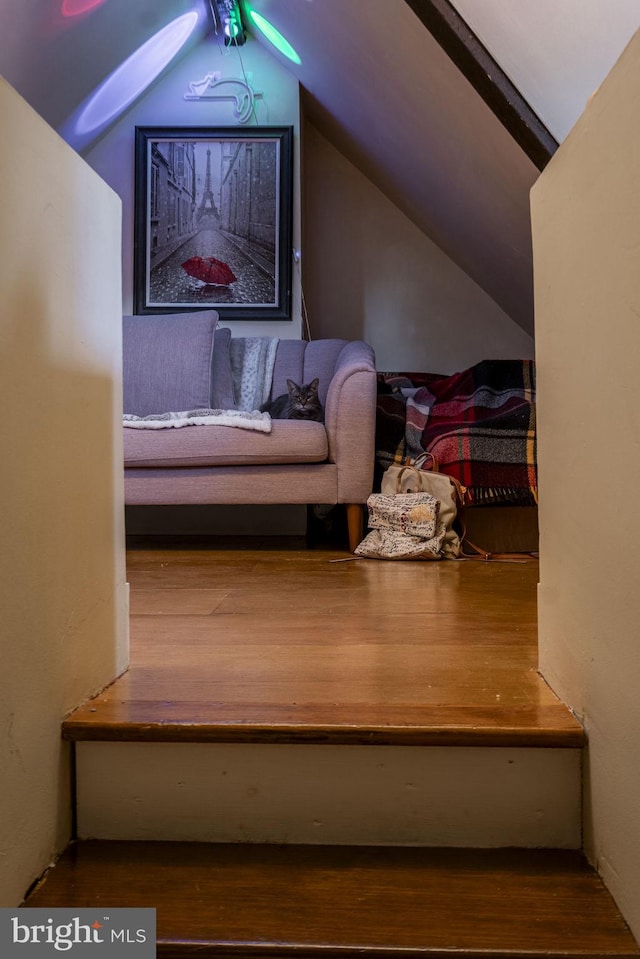 bedroom featuring hardwood / wood-style floors and vaulted ceiling