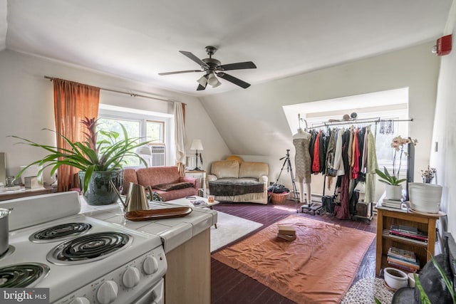 bedroom with lofted ceiling, dark wood-type flooring, and ceiling fan