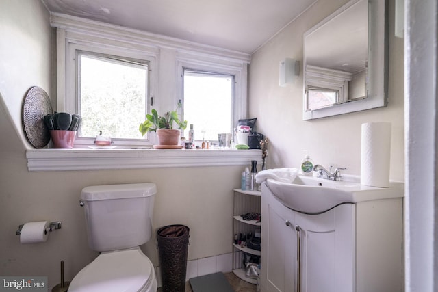 bathroom featuring vanity and toilet