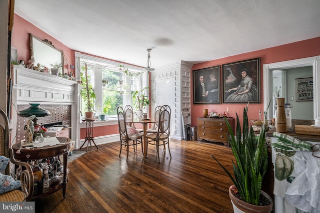 dining room with dark hardwood / wood-style floors