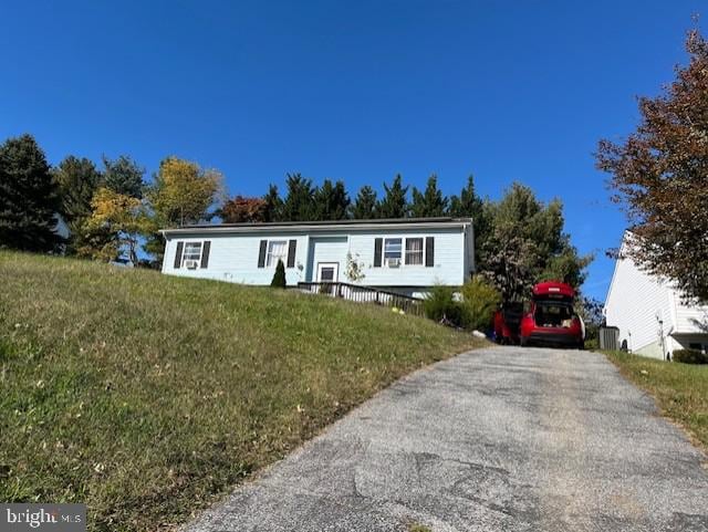 view of front of home with a front lawn