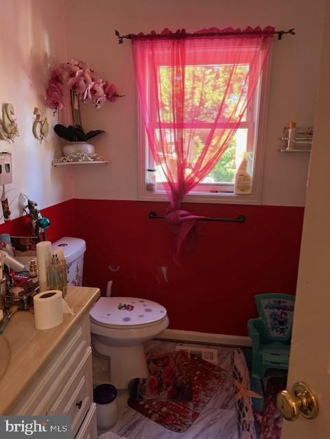 bathroom with vanity and toilet