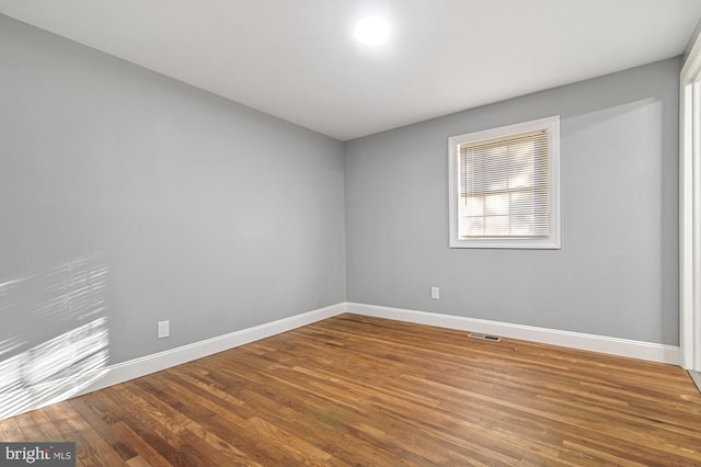 empty room featuring hardwood / wood-style floors