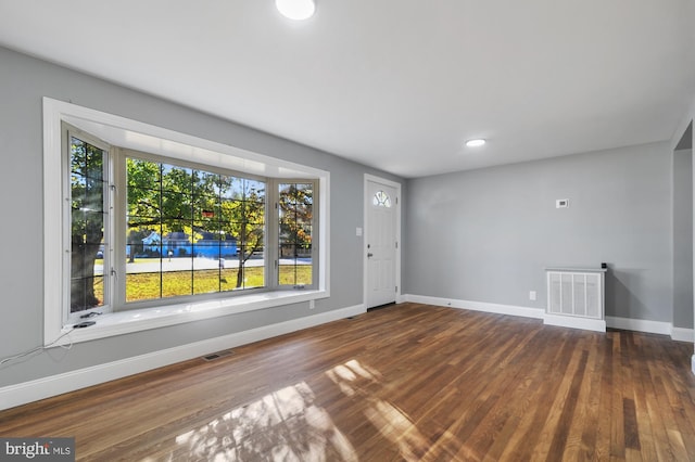 empty room featuring hardwood / wood-style flooring