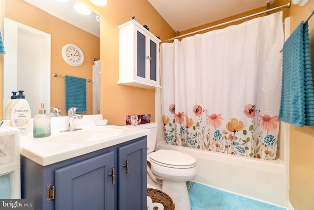 full bathroom with vanity, toilet, and shower / bath combo with shower curtain