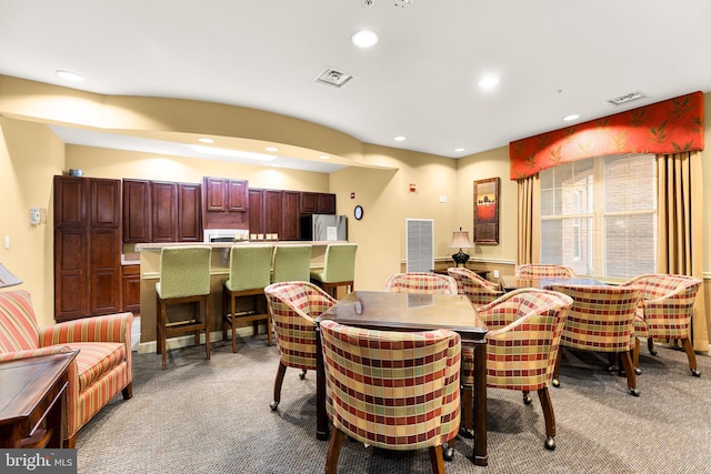 view of carpeted dining area