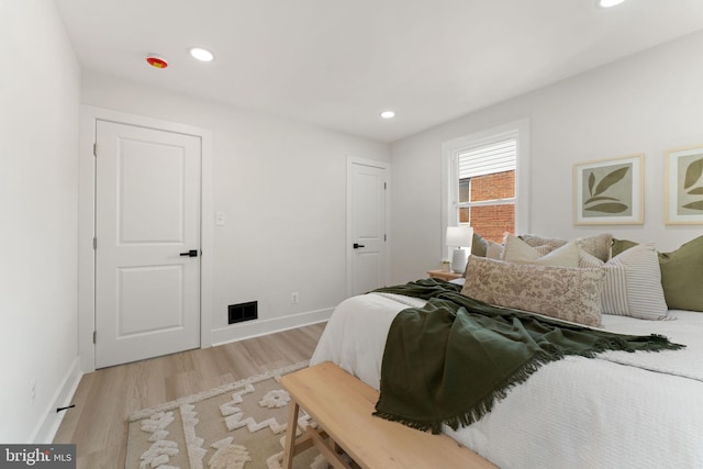 bedroom with light hardwood / wood-style flooring