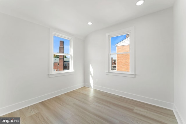 unfurnished room with light wood-type flooring