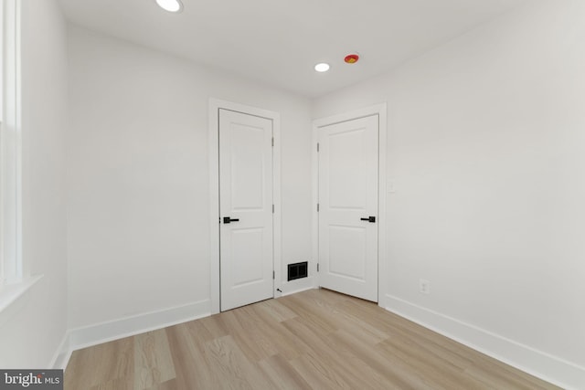 unfurnished room featuring light hardwood / wood-style floors