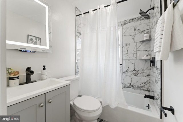 full bathroom with vanity, shower / tub combo, and toilet