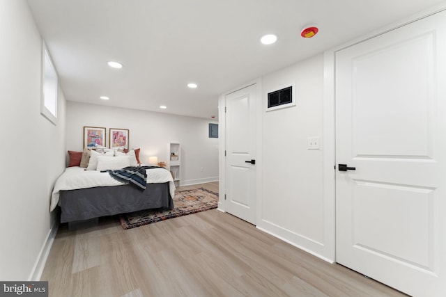 bedroom featuring light hardwood / wood-style floors