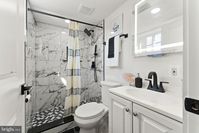 bathroom with vanity, a shower with curtain, and toilet