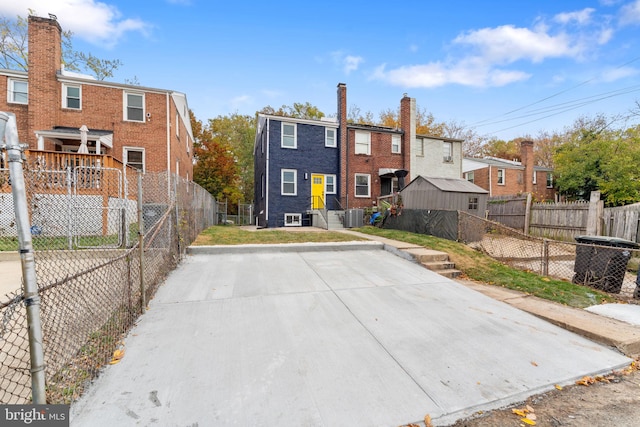 back of property featuring cooling unit