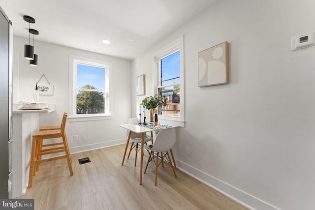 dining room with light wood-type flooring