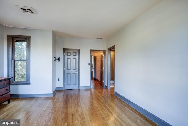 unfurnished room featuring light hardwood / wood-style floors