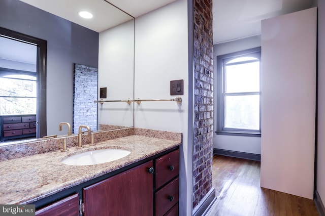 bathroom with vanity and hardwood / wood-style flooring