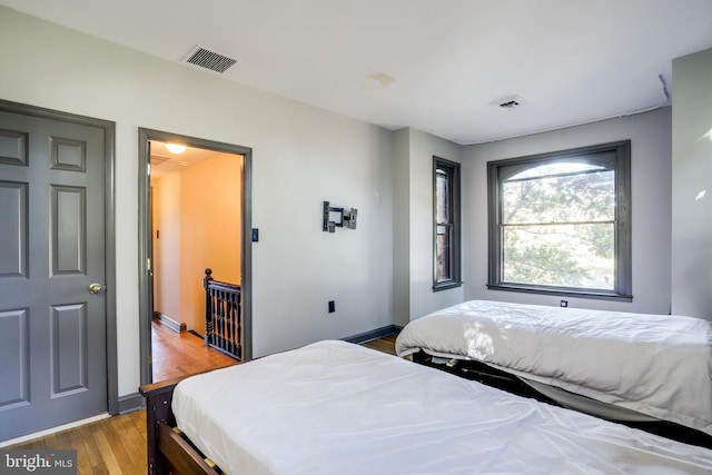 bedroom with light hardwood / wood-style flooring