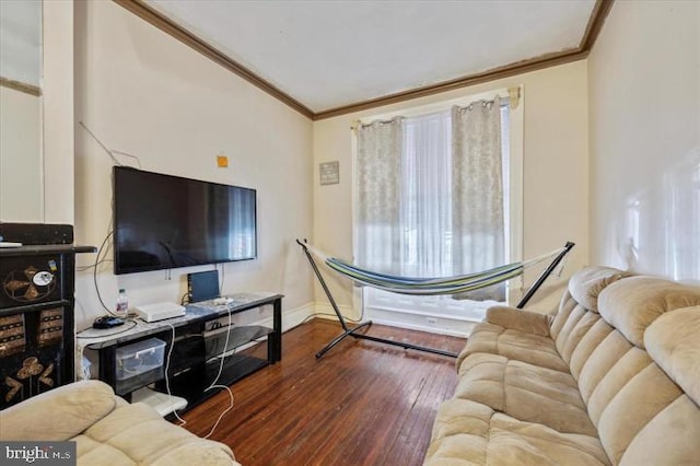 living room with crown molding and dark hardwood / wood-style flooring