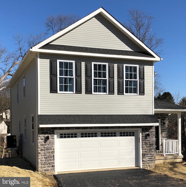 view of front of property featuring a garage