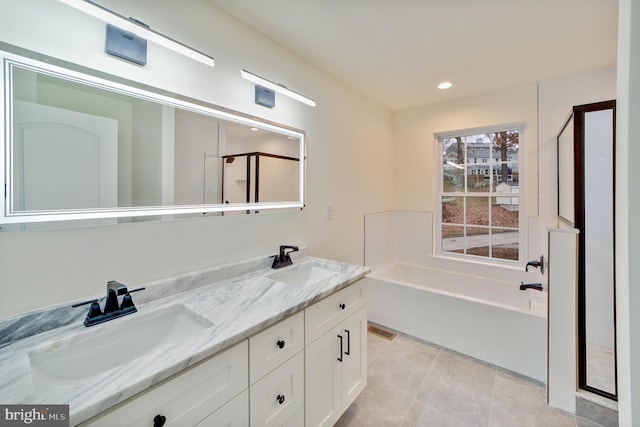 bathroom with vanity, tile patterned floors, and separate shower and tub