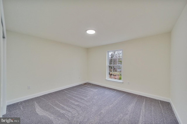 unfurnished room with carpet floors