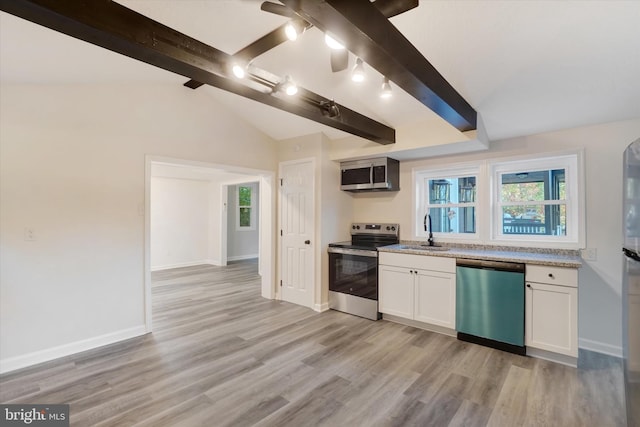 kitchen featuring white cabinets, stainless steel appliances, sink, and light wood-type flooring