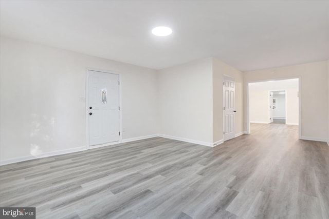 unfurnished room featuring light wood-type flooring