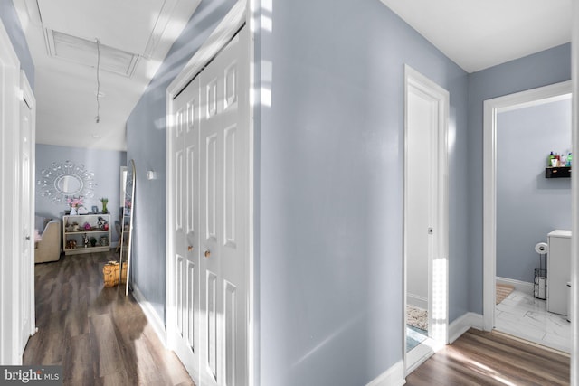 hall featuring dark hardwood / wood-style flooring and lofted ceiling