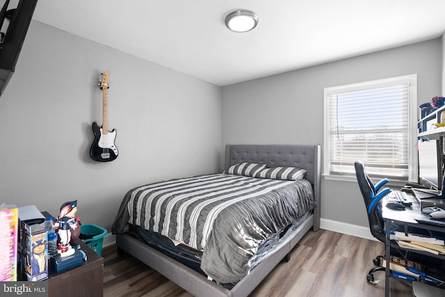 bedroom featuring hardwood / wood-style floors