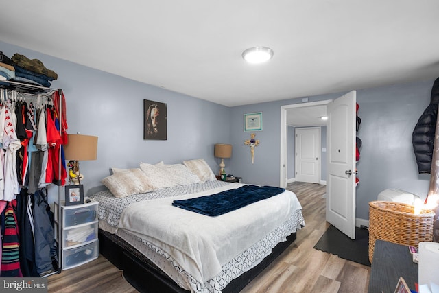 bedroom with hardwood / wood-style flooring