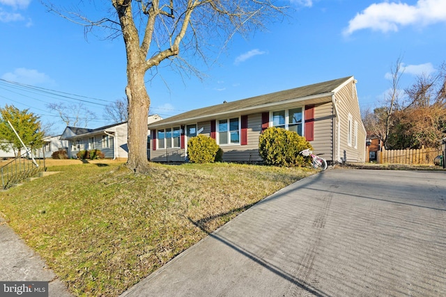 single story home with a front yard