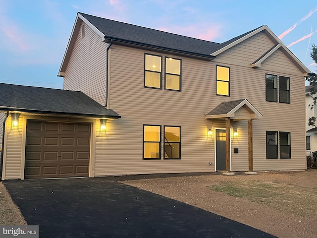 view of front of property with a garage