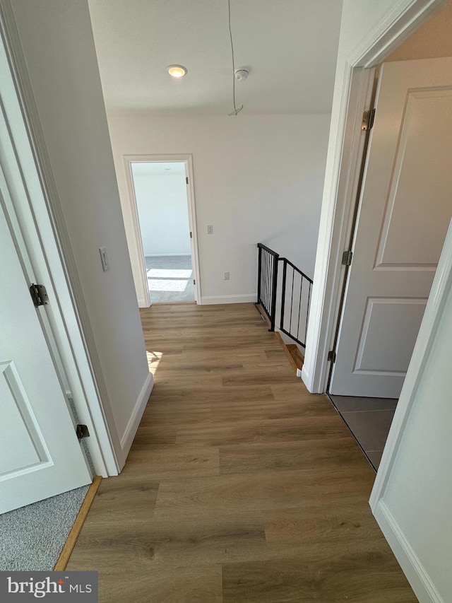 corridor featuring hardwood / wood-style flooring