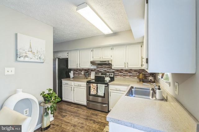 kitchen featuring dark wood-type flooring, appliances with stainless steel finishes, sink, and white cabinets