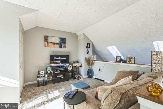 carpeted living room featuring lofted ceiling with skylight and a textured ceiling