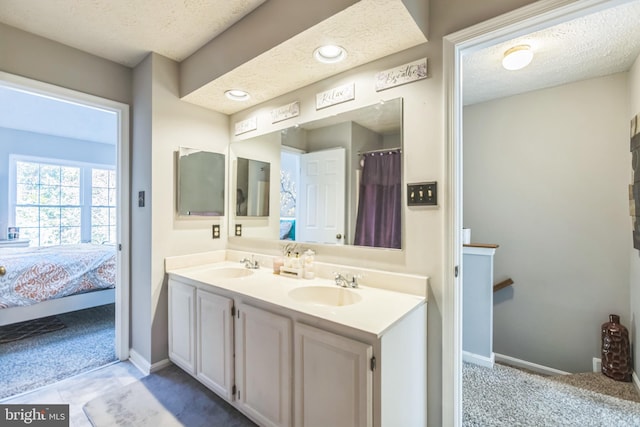 bathroom featuring vanity and a textured ceiling