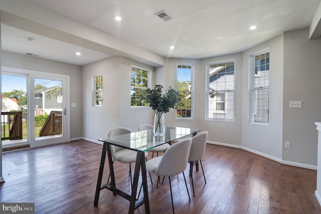 dining room with dark hardwood / wood-style flooring