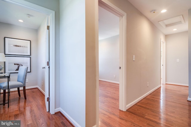 corridor with wood-type flooring