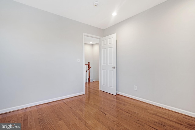 unfurnished room featuring hardwood / wood-style flooring