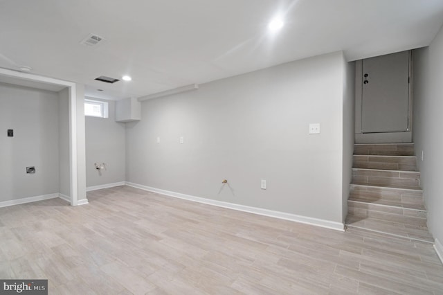 basement featuring light hardwood / wood-style floors