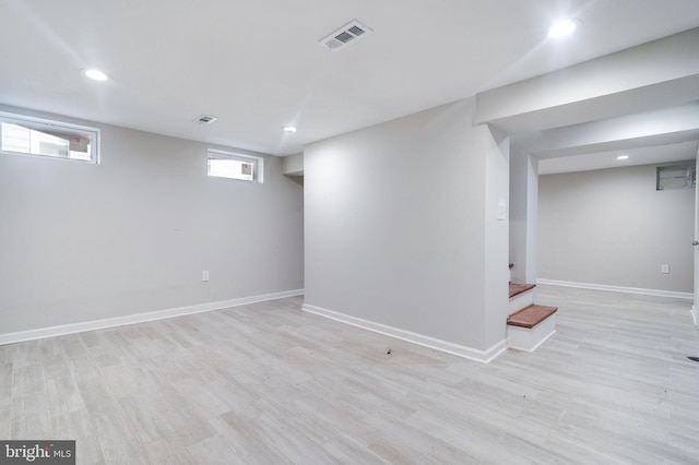 basement featuring light wood-type flooring